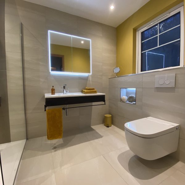 WC in bathroom with backlit mirror cabinet