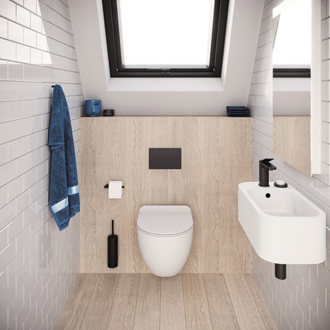 Attic bathroom with toilet and sink